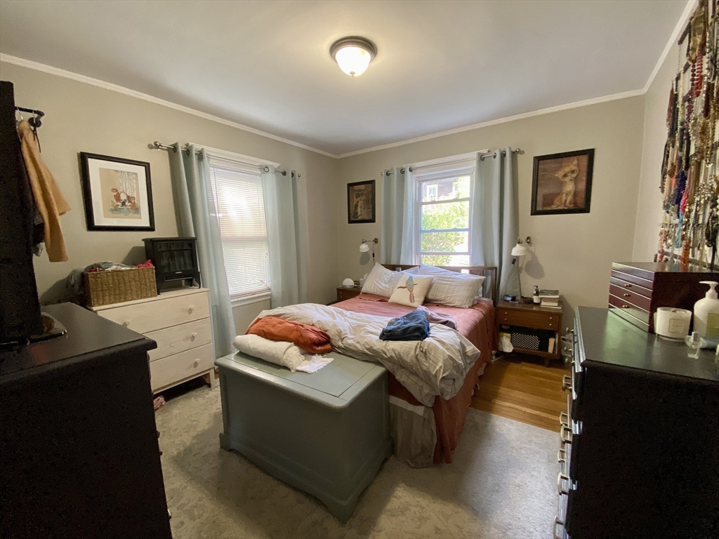 12 St Peter Street, Unit 1 Boston, MA 02130 - Photo 9 of 20 a bedroom with a bed and wooden floor