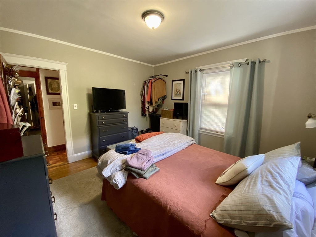 12 St Peter Street, Unit 1 Boston, MA 02130 - Photo 10 of 20 a bedroom with a bed and a flat screen tv