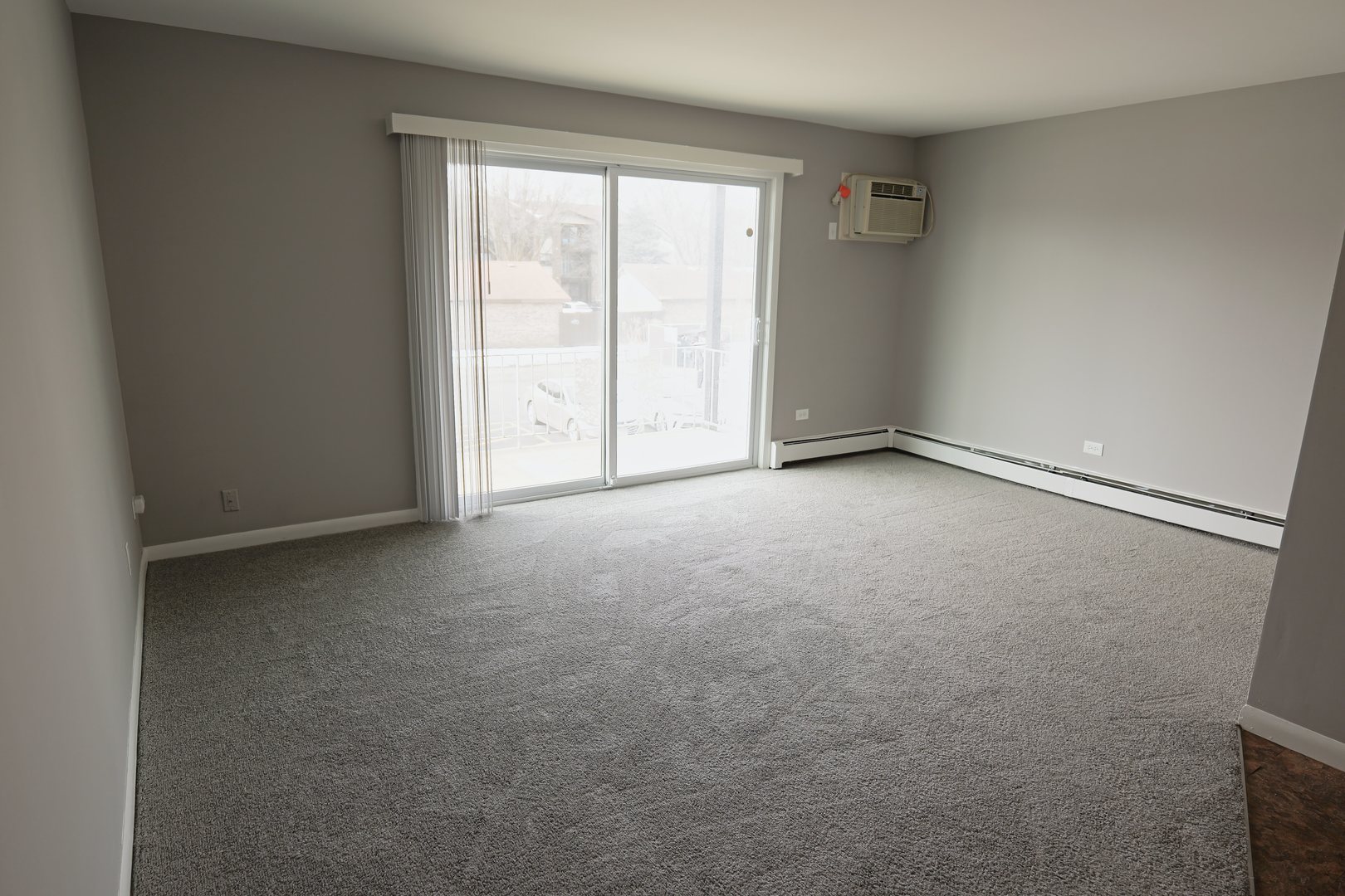 12630 South Alpine Drive, Unit 7 Alsip, IL 60803 - Photo 2 of 9 a view of an empty room with a window