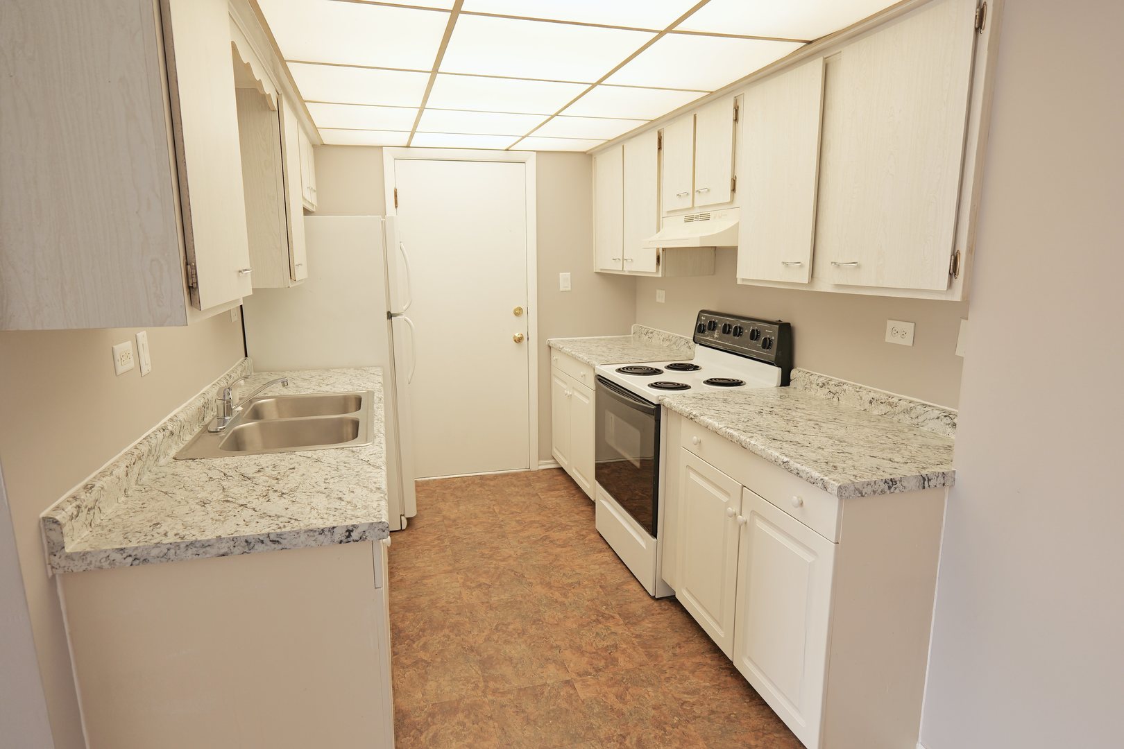 12630 South Alpine Drive, Unit 7 Alsip, IL 60803 - Photo 4 of 9 a kitchen with stainless steel appliances granite countertop a sink stove and cabinets