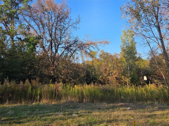 a view of lake with green space