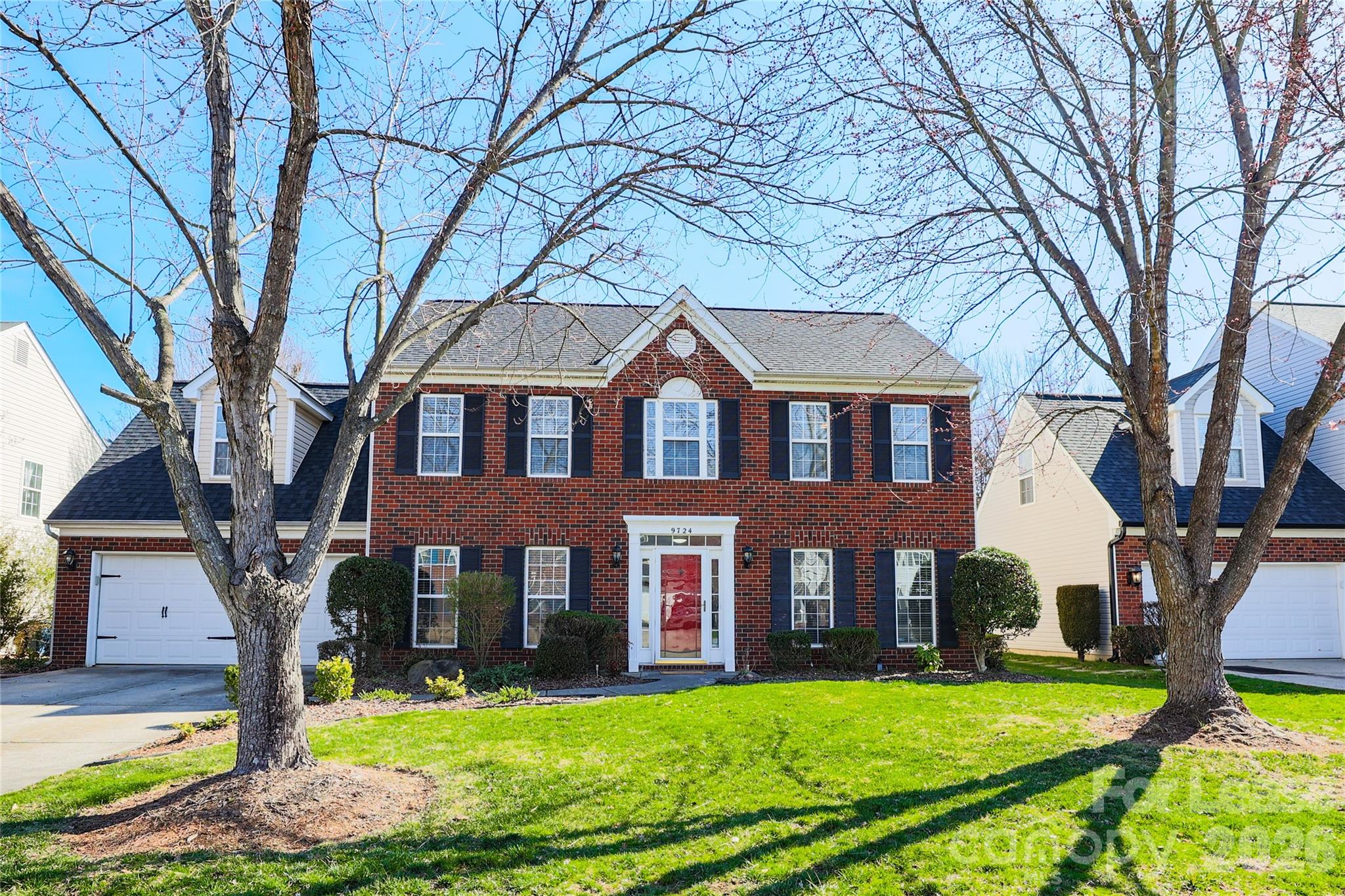 9724 Steele Meadow Road Charlotte, NC 28273 - Photo 1 of 38 a front view of a house with yard and green space