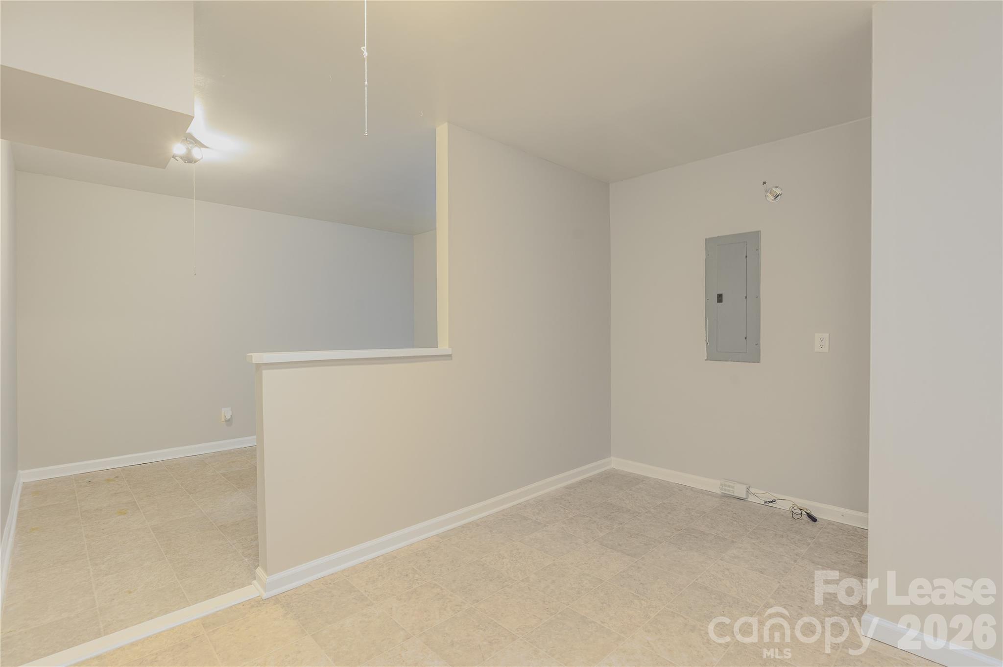 9724 Steele Meadow Road Charlotte, NC 28273 - Photo 19 of 38 an empty room with a workbench