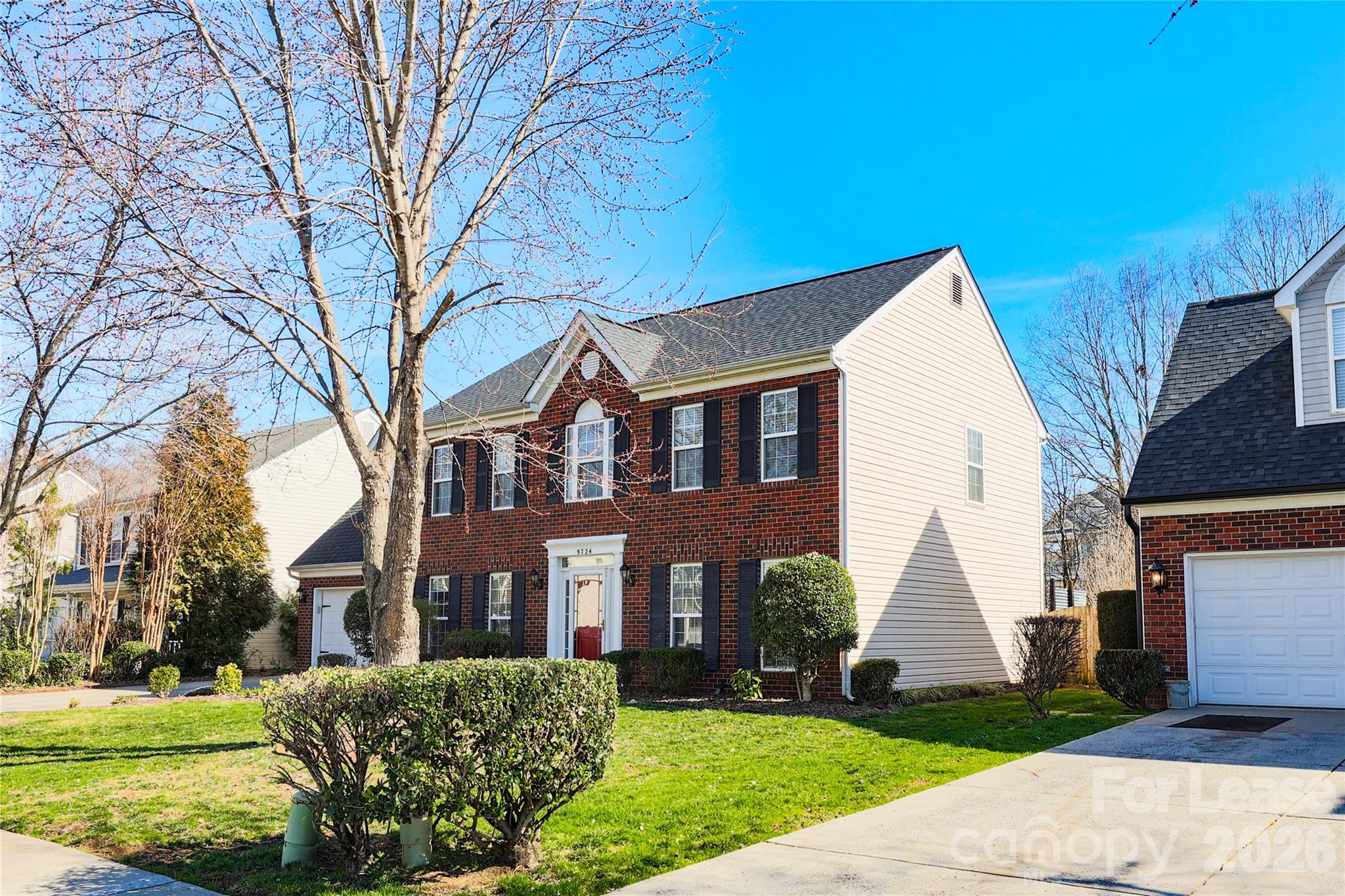 9724 Steele Meadow Road Charlotte, NC 28273 - Photo 2 of 38 a view of a white house with a yard