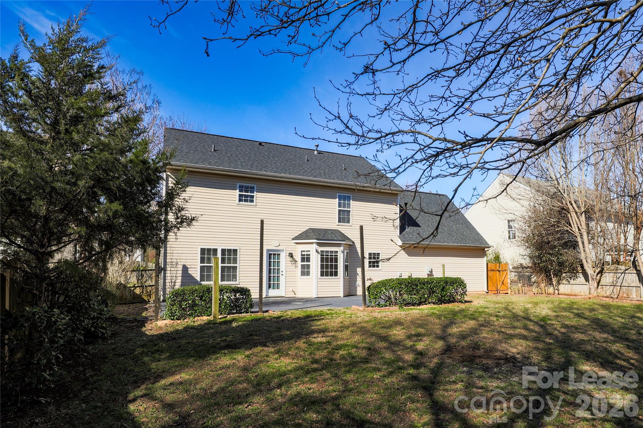 9724 Steele Meadow Road Charlotte, NC 28273 - Photo 34 of 38 a front view of a house with a garden