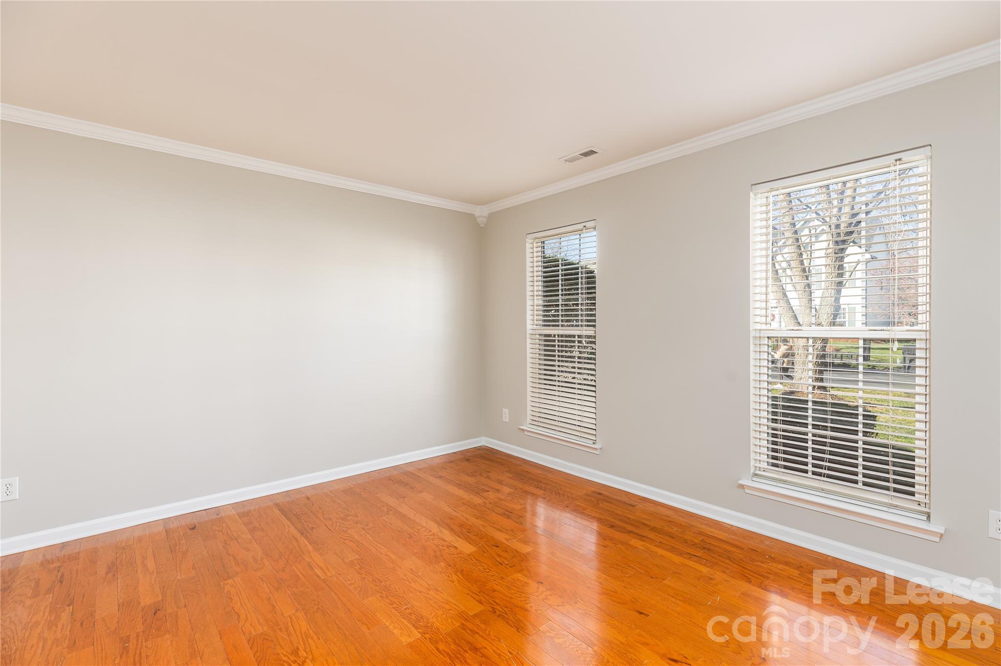 9724 Steele Meadow Road Charlotte, NC 28273 - Photo 6 of 38 a view of an empty room with a window