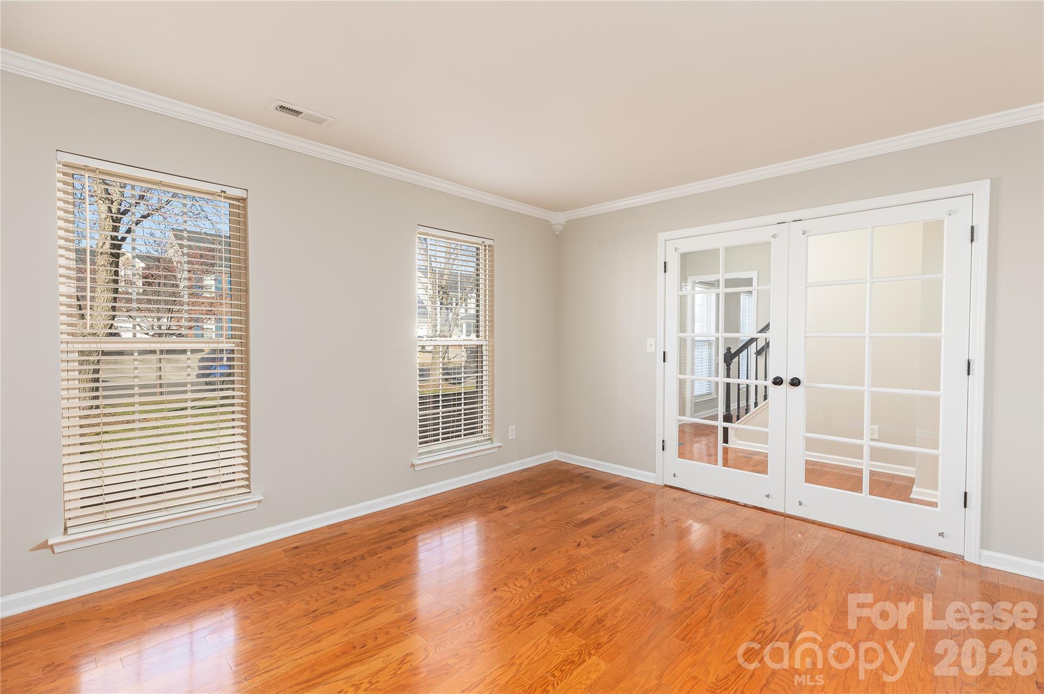 9724 Steele Meadow Road Charlotte, NC 28273 - Photo 7 of 38 a view of an empty room with a window