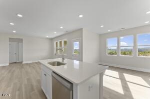 2760 River Meadow Spring Hope, NC 27882 - Photo 15 of 42 a kitchen with stainless steel appliances granite countertop a sink and a large window