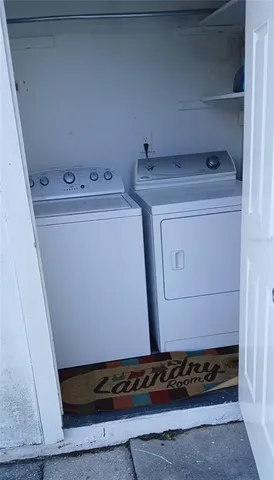 a utility room with washer and dryer