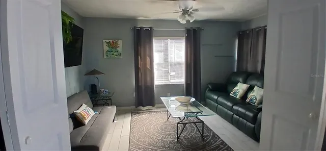 a bedroom with a bed and a mirror