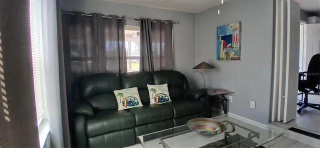 a living room with furniture and a window