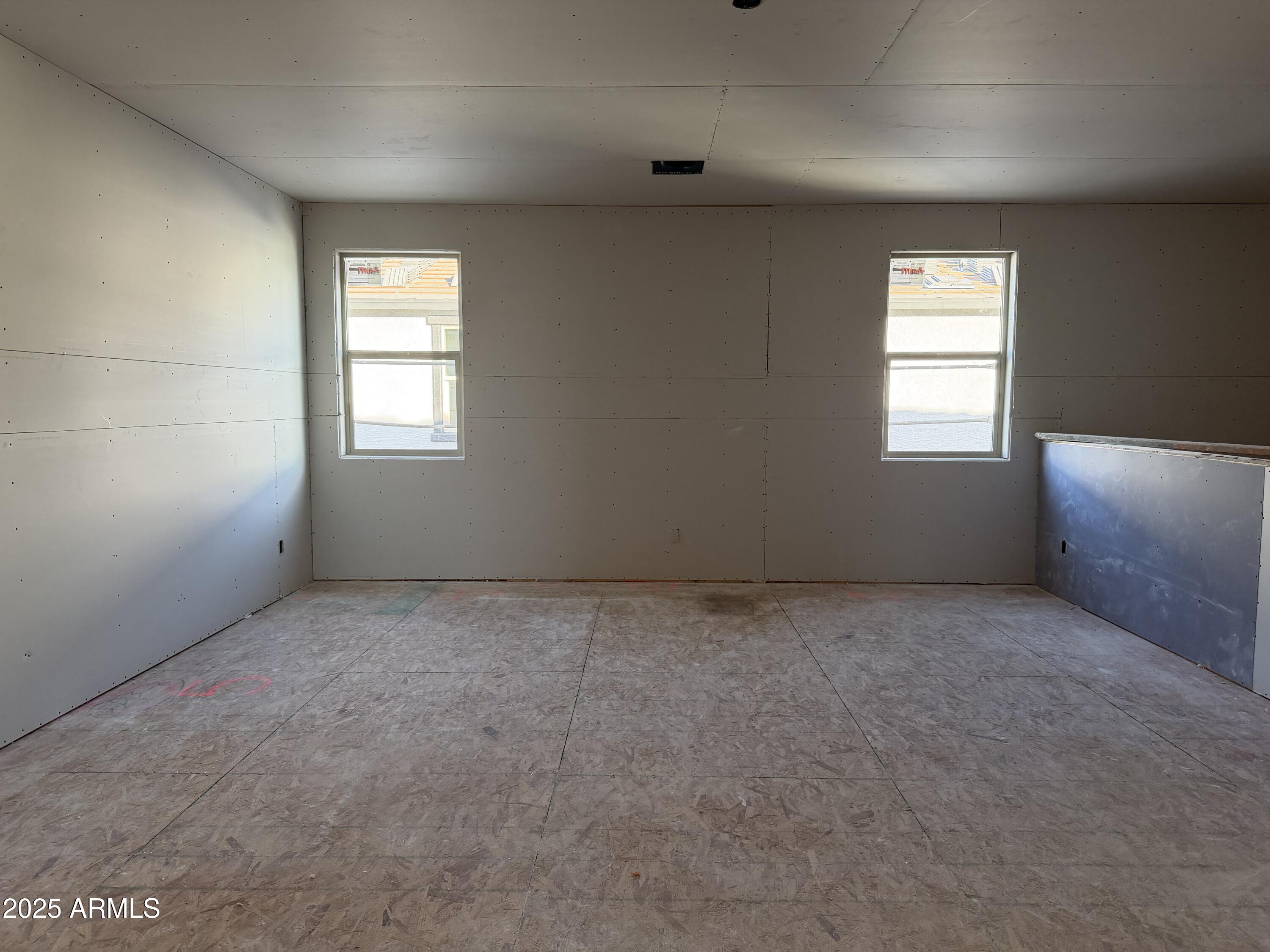 5518 West Hayduk Road Laveen, AZ 85339 - Photo 16 of 35 an empty room with windows