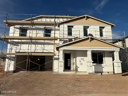 a front view of a house with garage