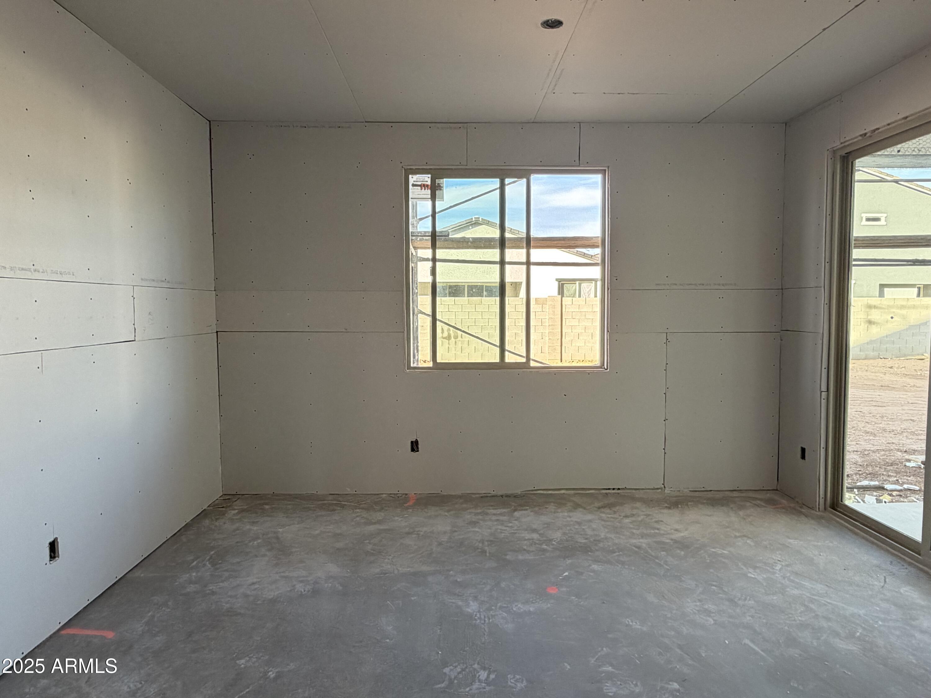5518 West Hayduk Road Laveen, AZ 85339 - Photo 8 of 35 an empty room with a window
