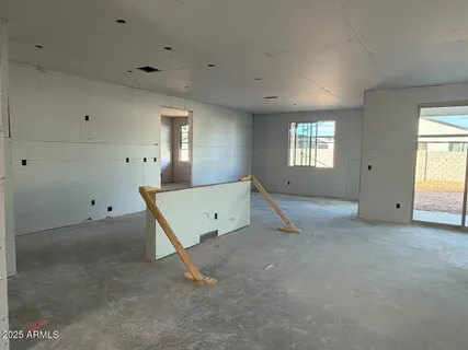 a view of an empty room with windows