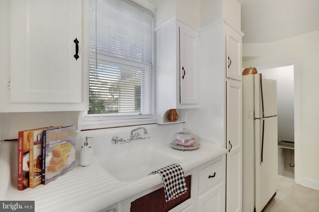 a bathroom with a tub and a window