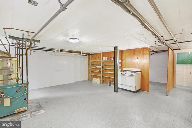 a view of storage and utility room with stairs