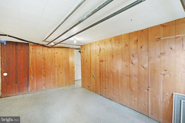 a white toilet sitting next to a bathroom sink and vanity
