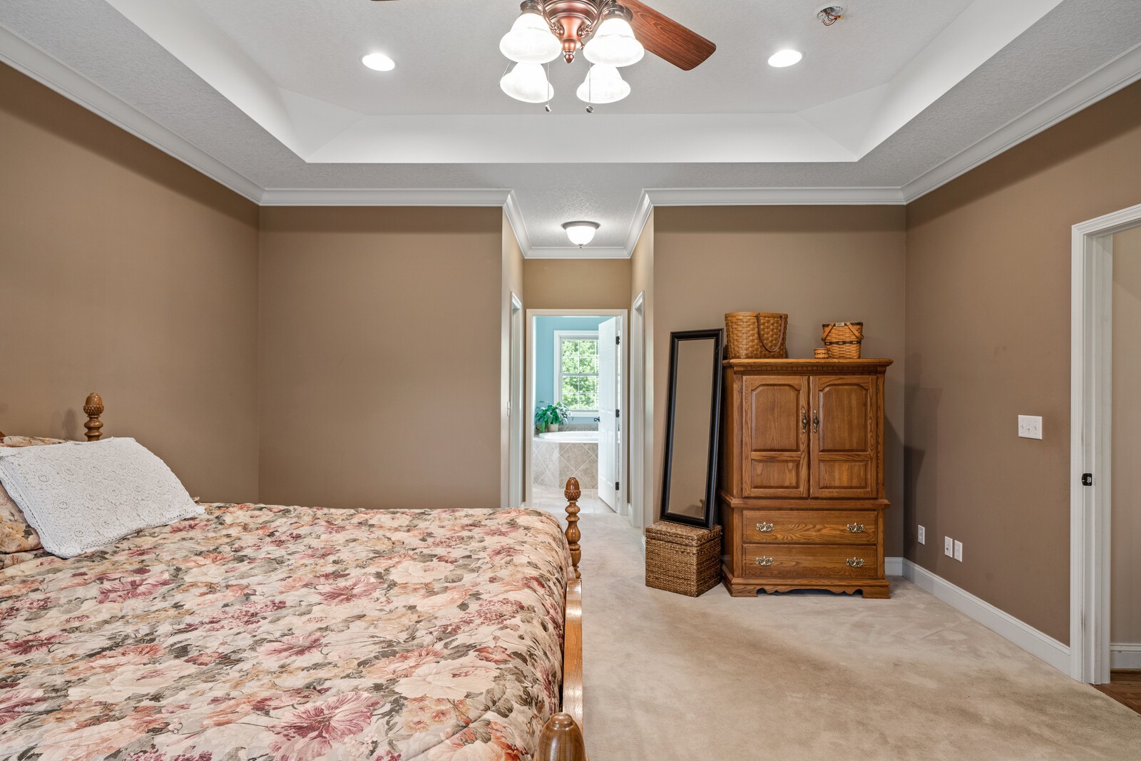 839 Corolla Road Sparta, TN 38583 - Photo 8 of 50 a bedroom with a bed and a chandelier