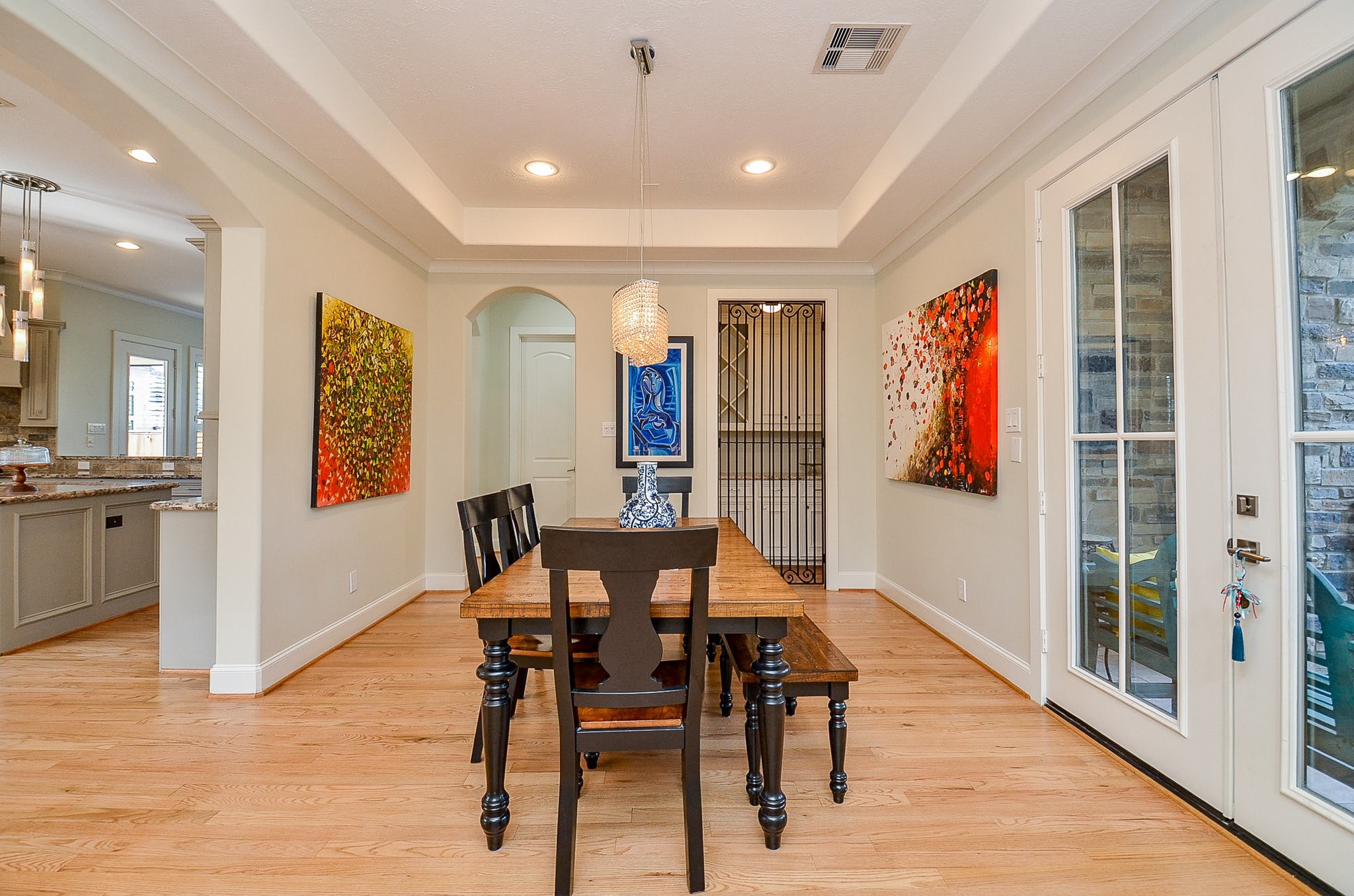 4625 Maple Street Bellaire, TX 77401 - Photo 13 of 47 a view of a dining room with furniture and wooden floor