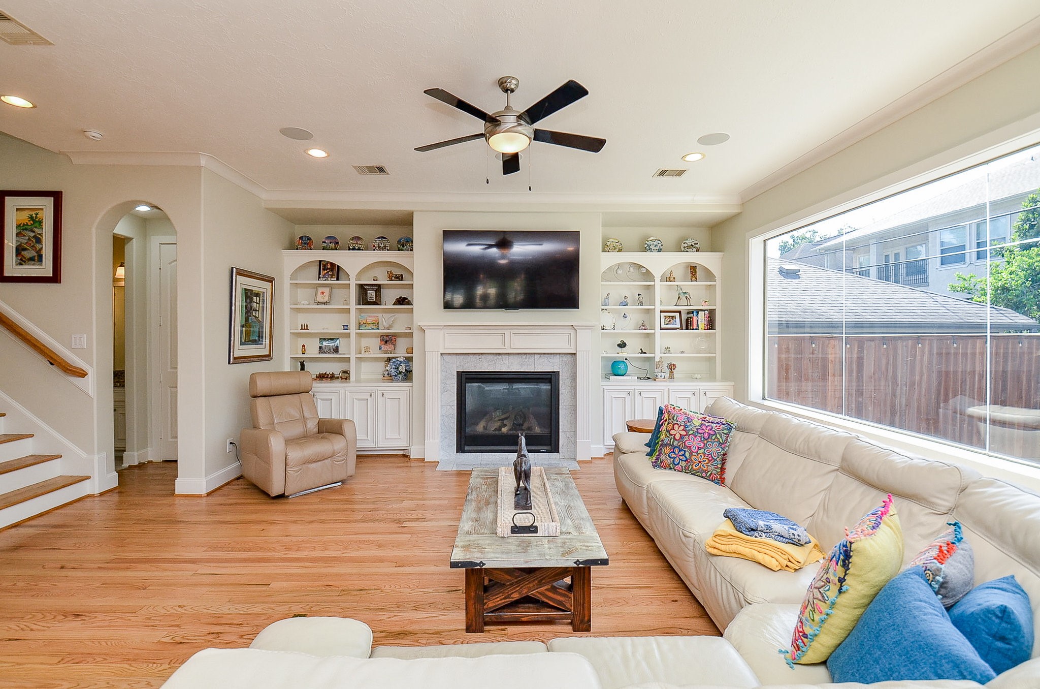 4625 Maple Street Bellaire, TX 77401 - Photo 16 of 47 a living room with furniture and a fireplace