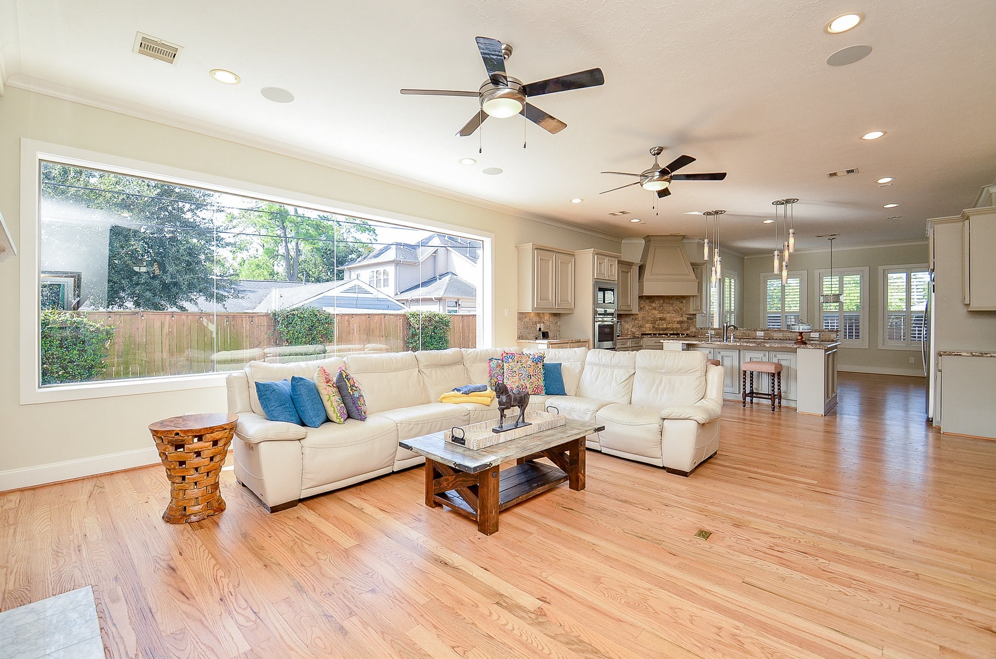4625 Maple Street Bellaire, TX 77401 - Photo 18 of 47 a living room with furniture and a large window
