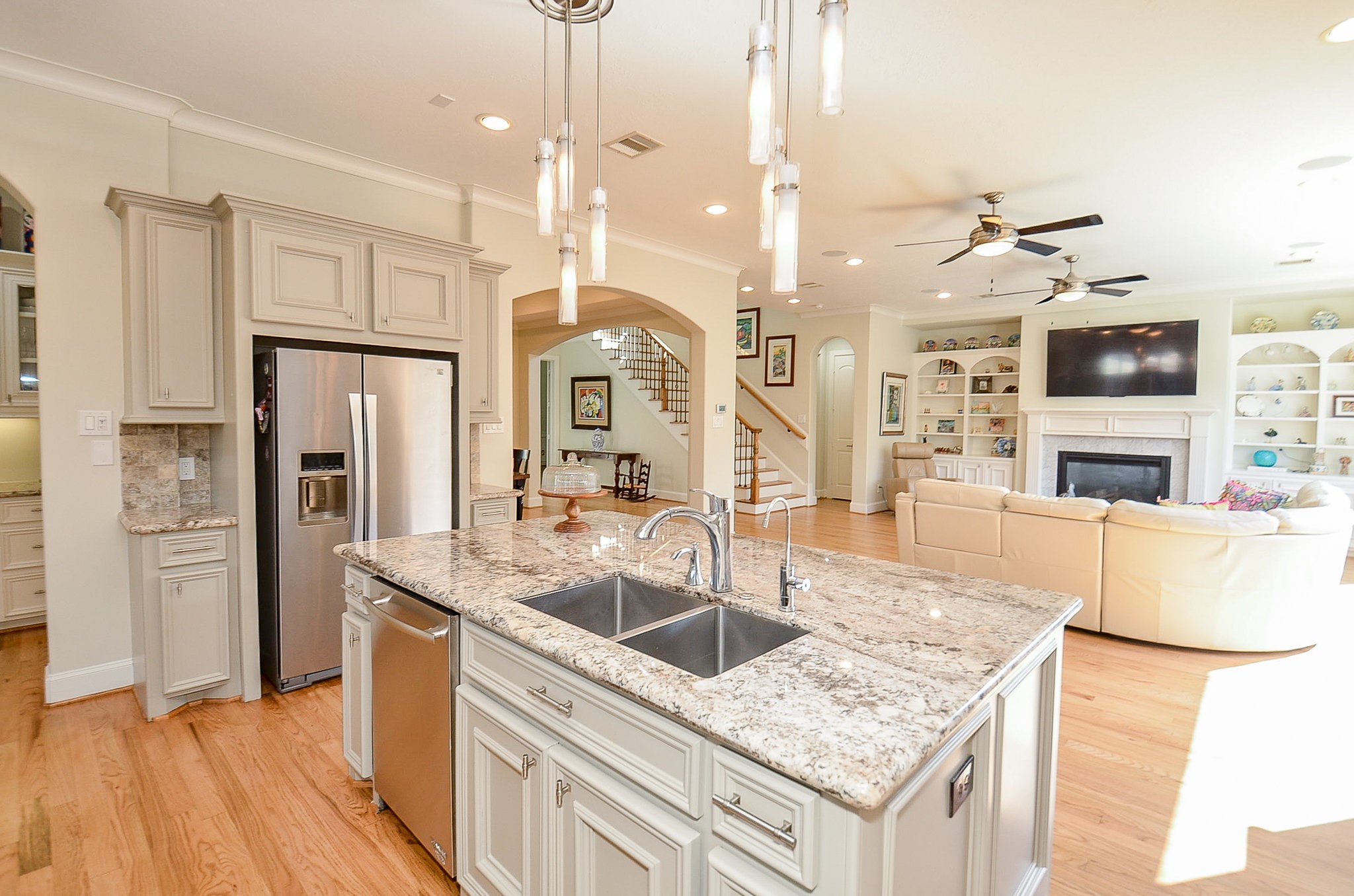 4625 Maple Street Bellaire, TX 77401 - Photo 20 of 47 a kitchen with stainless steel appliances granite countertop a sink a stove and a refrigerator