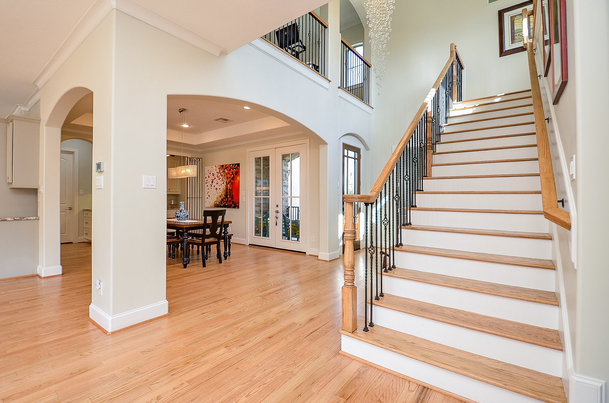 4625 Maple Street Bellaire, TX 77401 - Photo 26 of 47 a view of entryway and hall with wooden floor