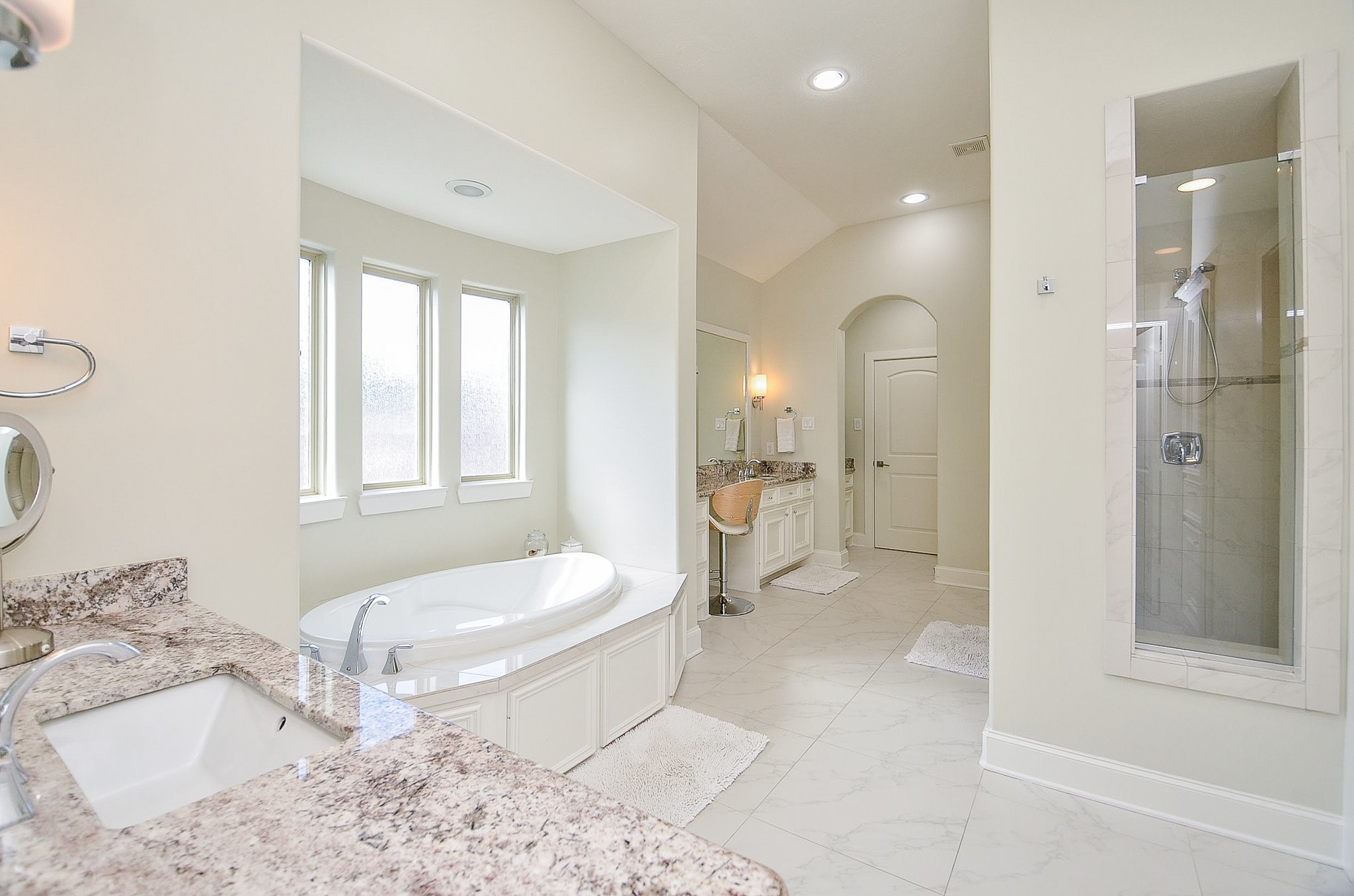 4625 Maple Street Bellaire, TX 77401 - Photo 34 of 47 a spacious bathroom with a toilet sink and shower