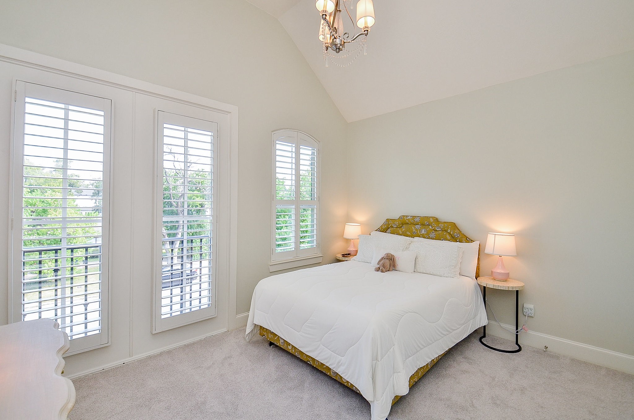 4625 Maple Street Bellaire, TX 77401 - Photo 38 of 47 a bedroom with a bed and a large window