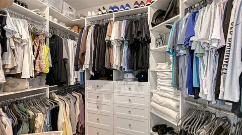 a bedroom with a balcony and a bed