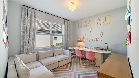 a bedroom with furniture and a book shelf