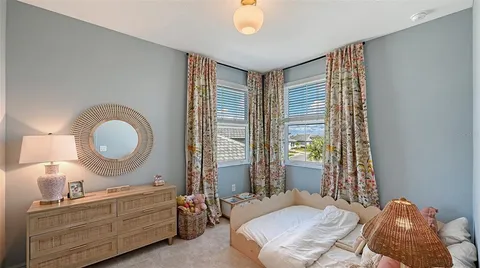 a view of a house with a small yard and plants