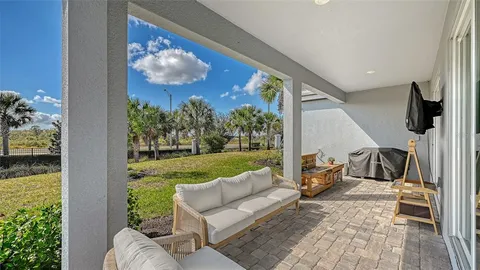 an aerial view of residential house with outdoor space and swimming pool