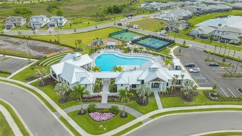 a front view of a house with a garden and patio