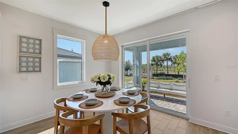 a view of a dining room with furniture window and outside view