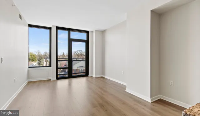 a view of an empty room and a window