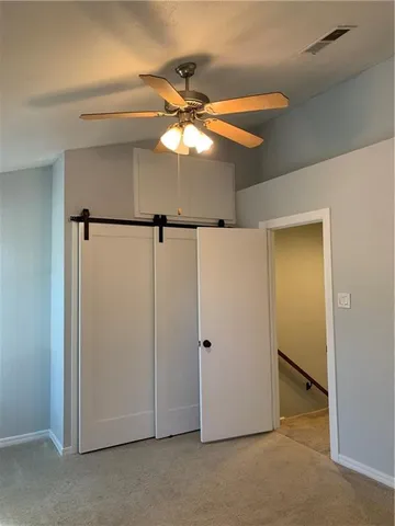 a view of a chandelier fan in a room