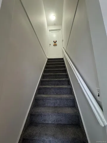 a kitchen with a stove a refrigerator and a sink
