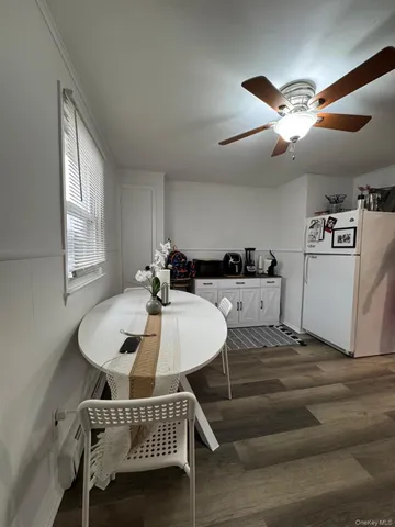 a kitchen with a cabinets and white appliances