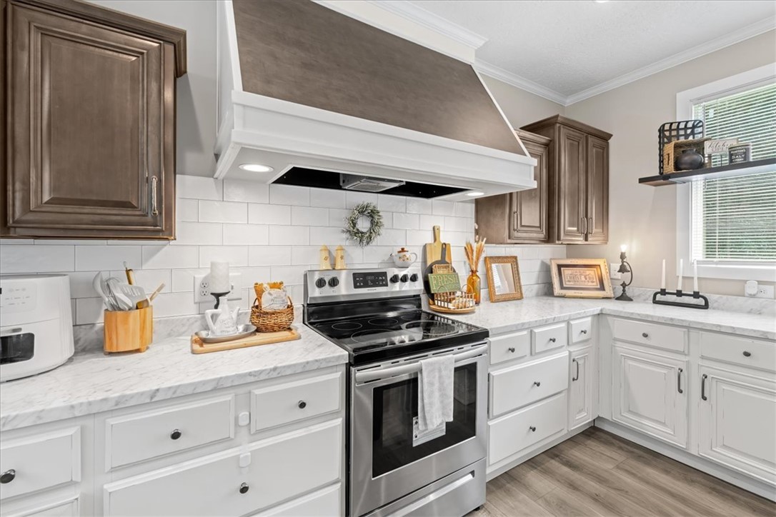 116 Parkview Road Iva, SC 29655 - Photo 15 of 44 Culinary creations come alive in this well-appointed kitchen, featuring a stainless steel range and ample counter space.