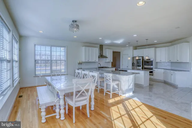 an empty room with a window and a fireplace