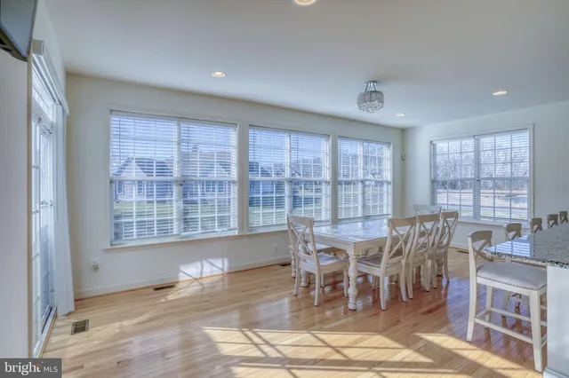 a view of an empty room with a window and a fireplace