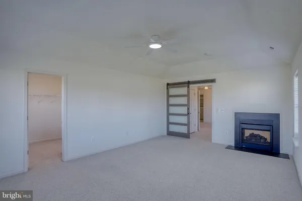 an empty room with a empty space and windows