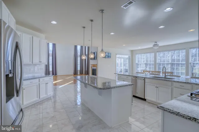 an empty room with a empty space and windows