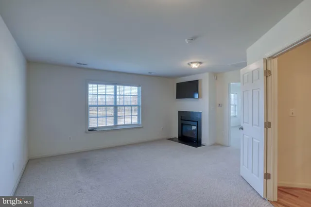 a patio with water glass top table and chairs