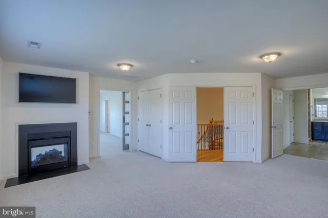 a view of a patio with a table and chairs