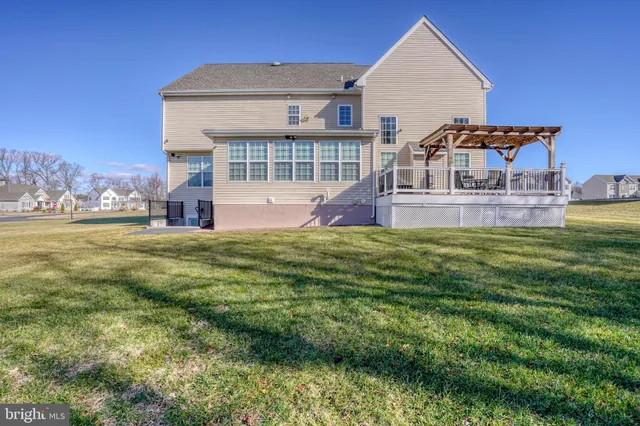 a view of a swimming pool with a yard