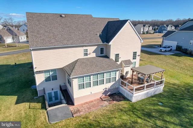a view of a chairs and table on the deck