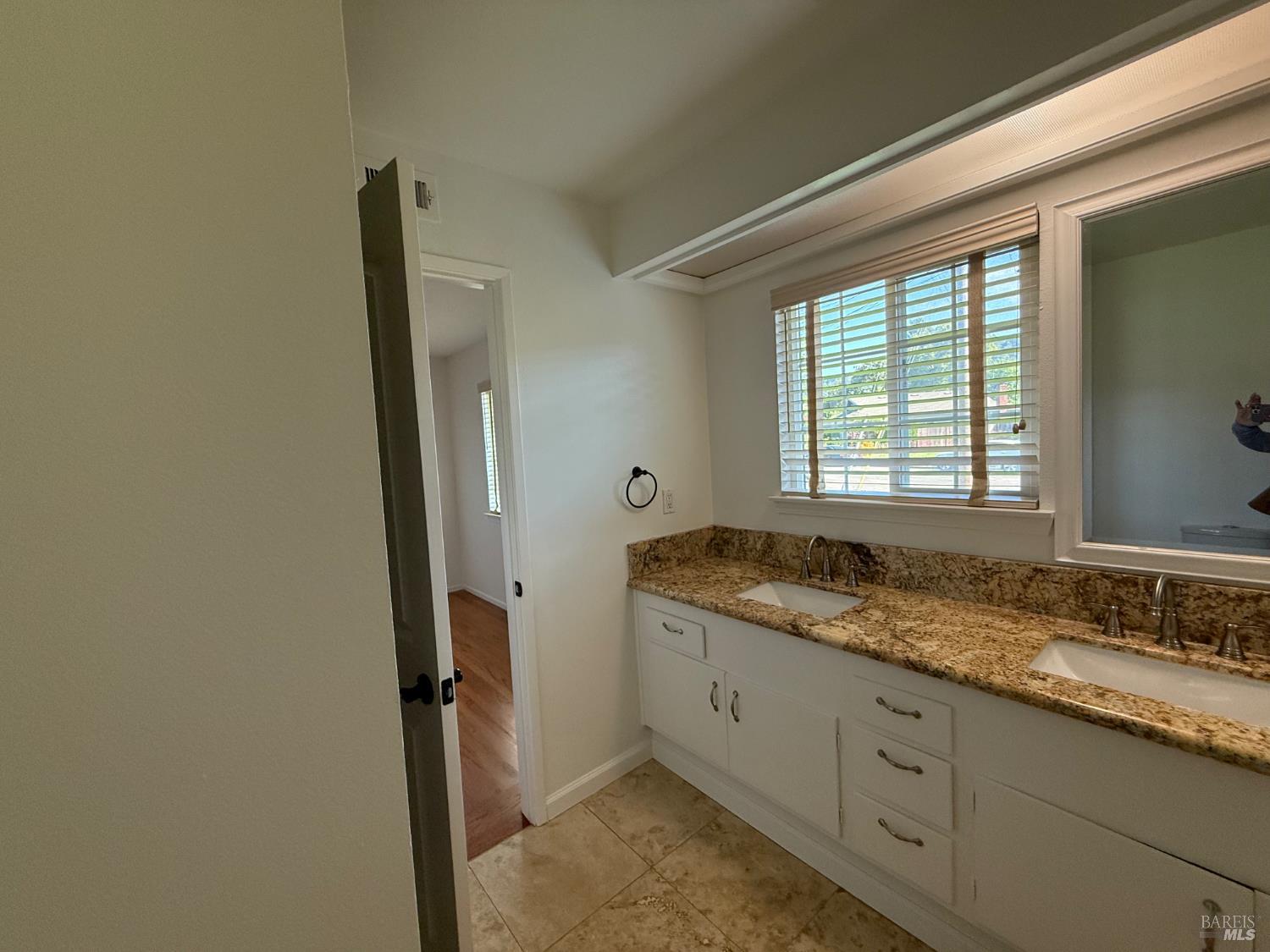 2553 Cactus Avenue Santa Rosa, CA 95405 - Photo 11 of 15 a bathroom with a granite countertop sink and a mirror